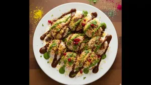 Top with tamarind sweet chutney, green chutney, chaat masala, and red chili powder, then garnish with sev, pomegranate seeds, and fresh coriander before serving.