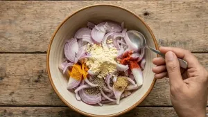 Add finely chopped green chilies and fresh coriander leaves to the mixture, and for extra crispiness, mix in 1–2 teaspoons of rice flour.