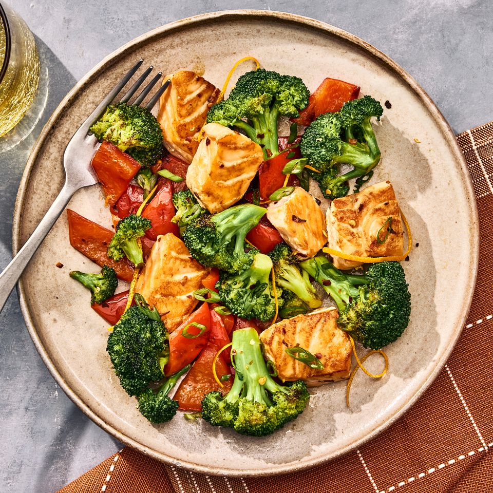 an image of the One-Skillet Garlicky Salmon and Broccoli Credit: Photographer: Morgan Hunt Glaze, Prop Stylist: Abby Armstrong, Food Stylist: Margaret Monroe Dickey