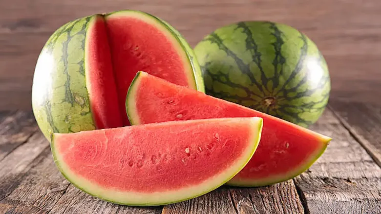 two watermelons with two slices