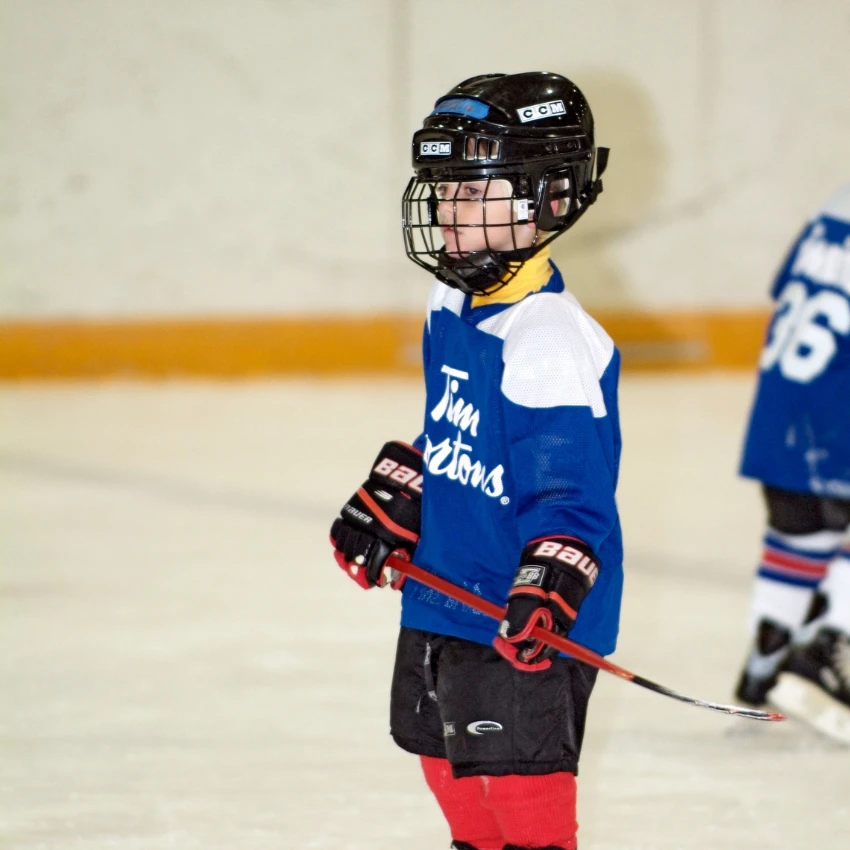 young boy on hockey team parents pay outrageous costs
