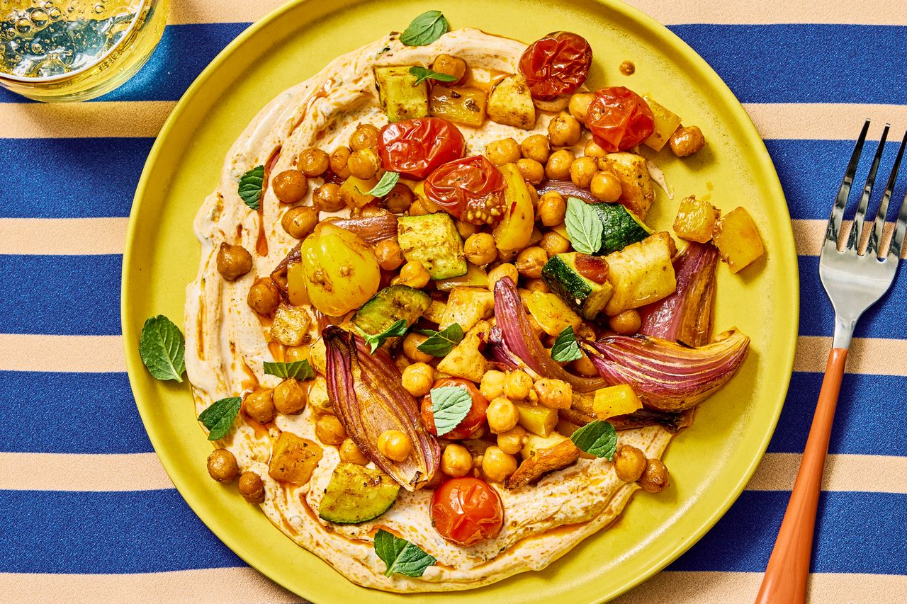 an image of the Sheet-Pan Halloumi with Roasted Chickpeas & Veggies Credit: Photographer: Morgan Hunt Glaze, Prop Stylist: Claire Spollen, Food Stylist: Chelsea Zimmer