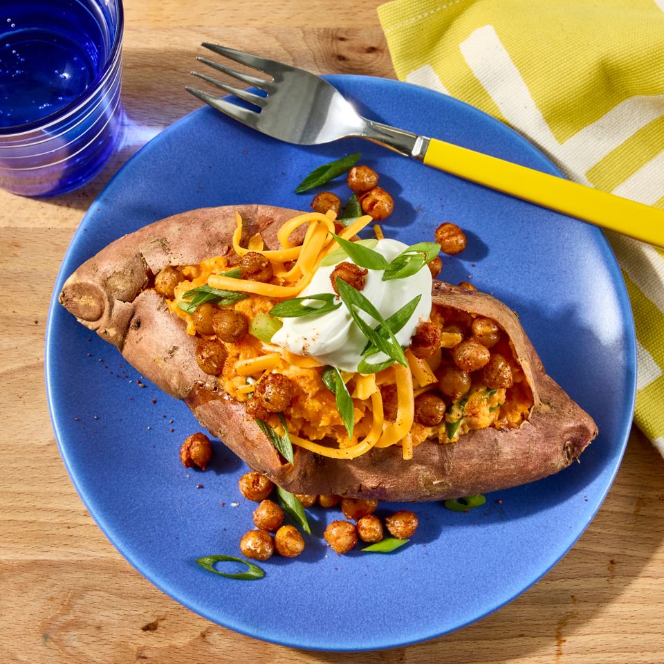 an image of the Loaded Chickpea Stuffed Sweet Potatoes Credit: Photographer: Jen Causey, Food Stylist: Chelsea Zimmer, Prop Stylist: Claire Spollen
