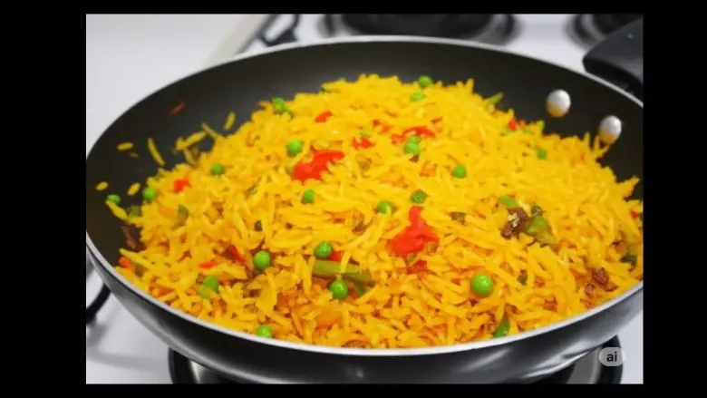 A steaming plate of Schezwan Fried Rice garnished with spring onions, ready to serve.