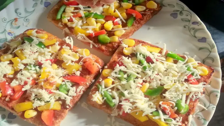 Stuffed bread pizza slice with cheese and vegetables.