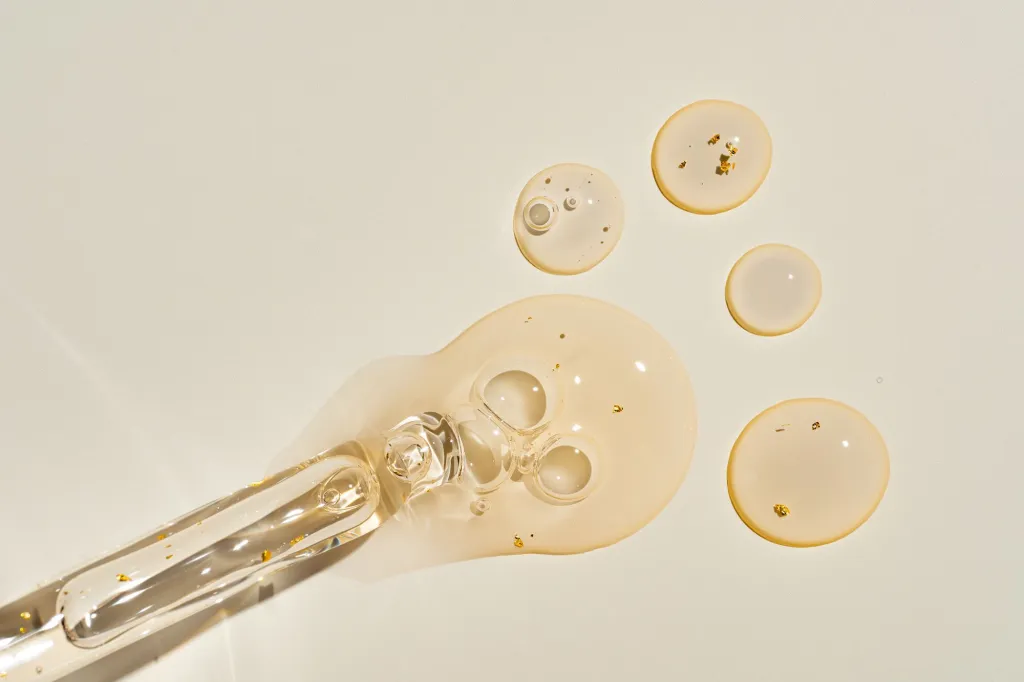 A dropper leaking serum.