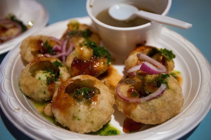 This may contain: small appetizers on a plate with dipping sauce