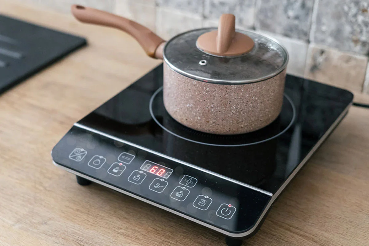 while using induction oven keep track of electric expense