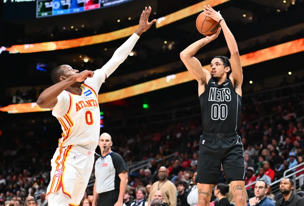Josh Minott shoots a jumper during the Nets' loss to the Hawks.