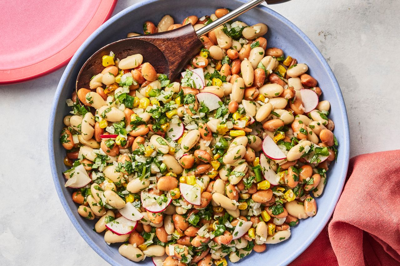 A recipe image of Easy Bean Salad with Herby Salsa Verde. Credit: Photographer: Greg Dupree, Prop Stylist: Julia Bayless, Food Stylist: Chelsea Zimmer.