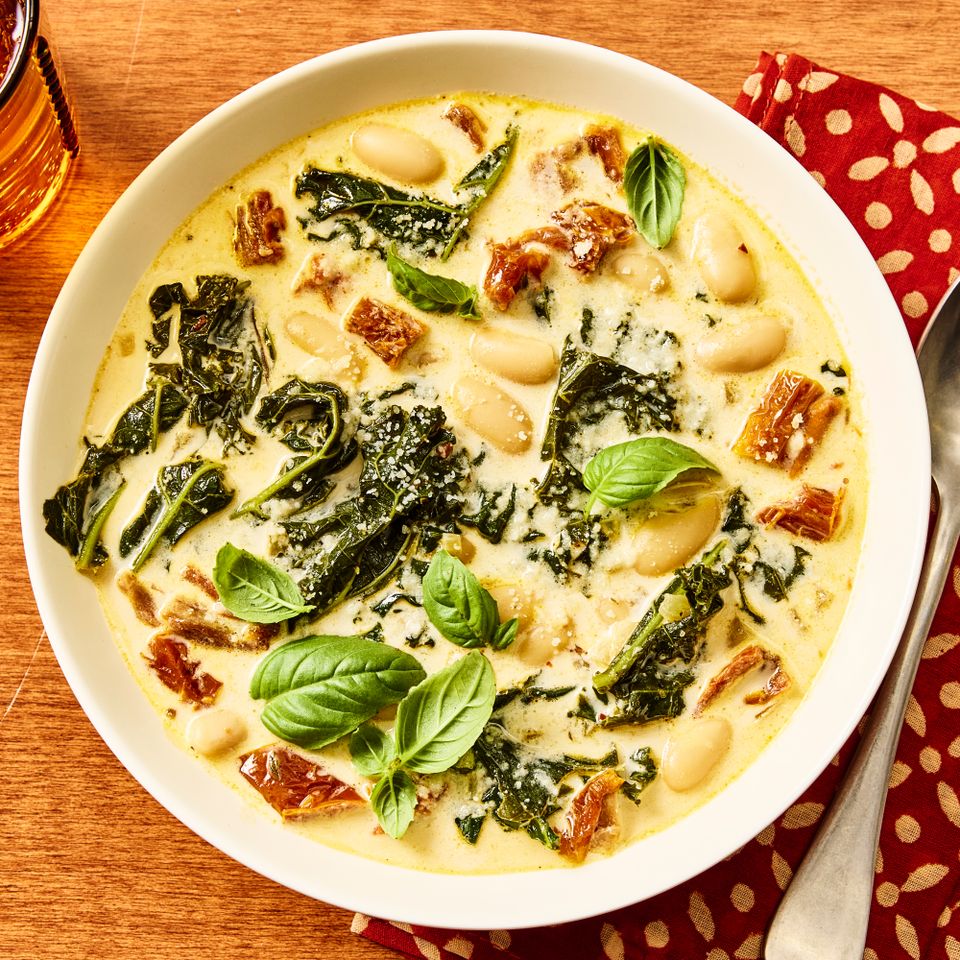 A recipe image of Marry Me White Bean Soup with Kale. Credit: Photographer: Morgan Hunt Ward, Prop Stylist: Priscilla Montiel, Food Stylist: Chelsea Zimmer.