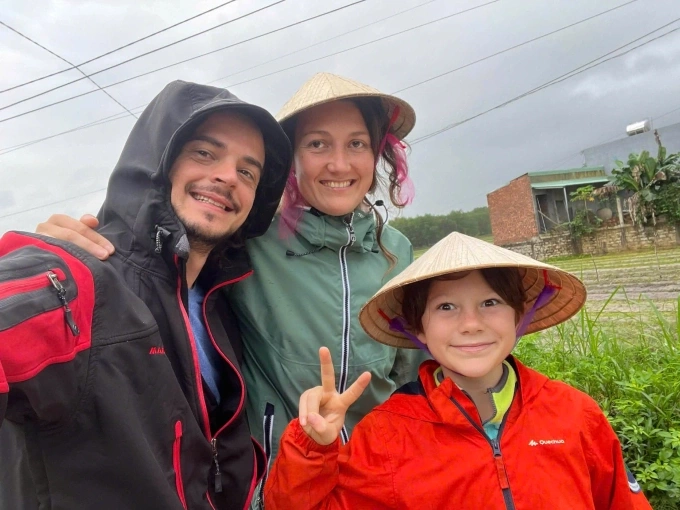 Ariane Triconnet (C), from France, her husband and their son in a farming experience in Da Nang, Vietnam. Photo courtesy of Triconnet