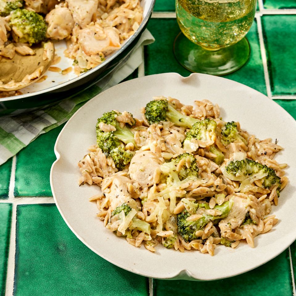 an image of the Cheesy One-Pot Chicken-Broccoli Orzo Credit: Photographer: Robby Lozano, Food Stylist: Emily Nabors Hall, Prop Stylist: Lydia Pursell