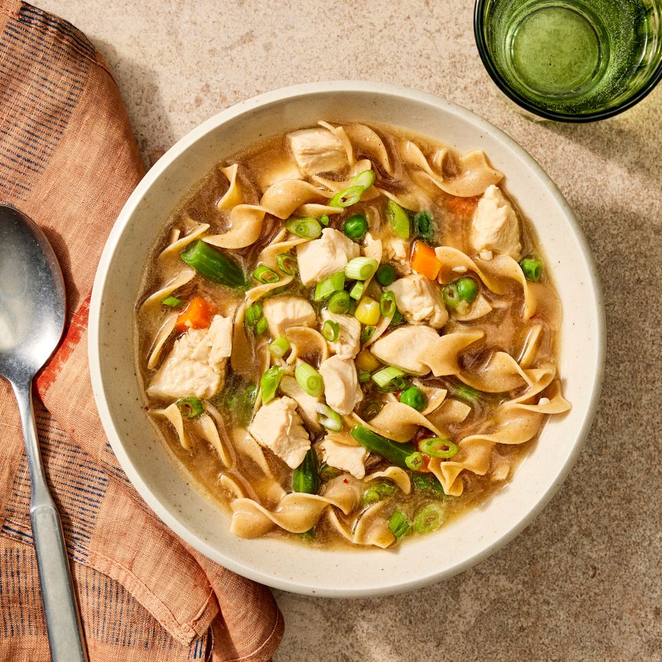 an image of the Sick Day Chicken Noodle Soup Credit: Photographer: Robby Lozano, Food Stylist: Emily Nabors Hall, Prop Stylist: Lydia Pursell