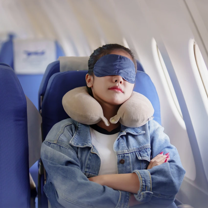 woman sleeping on plane