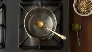 Heating saffron in water.