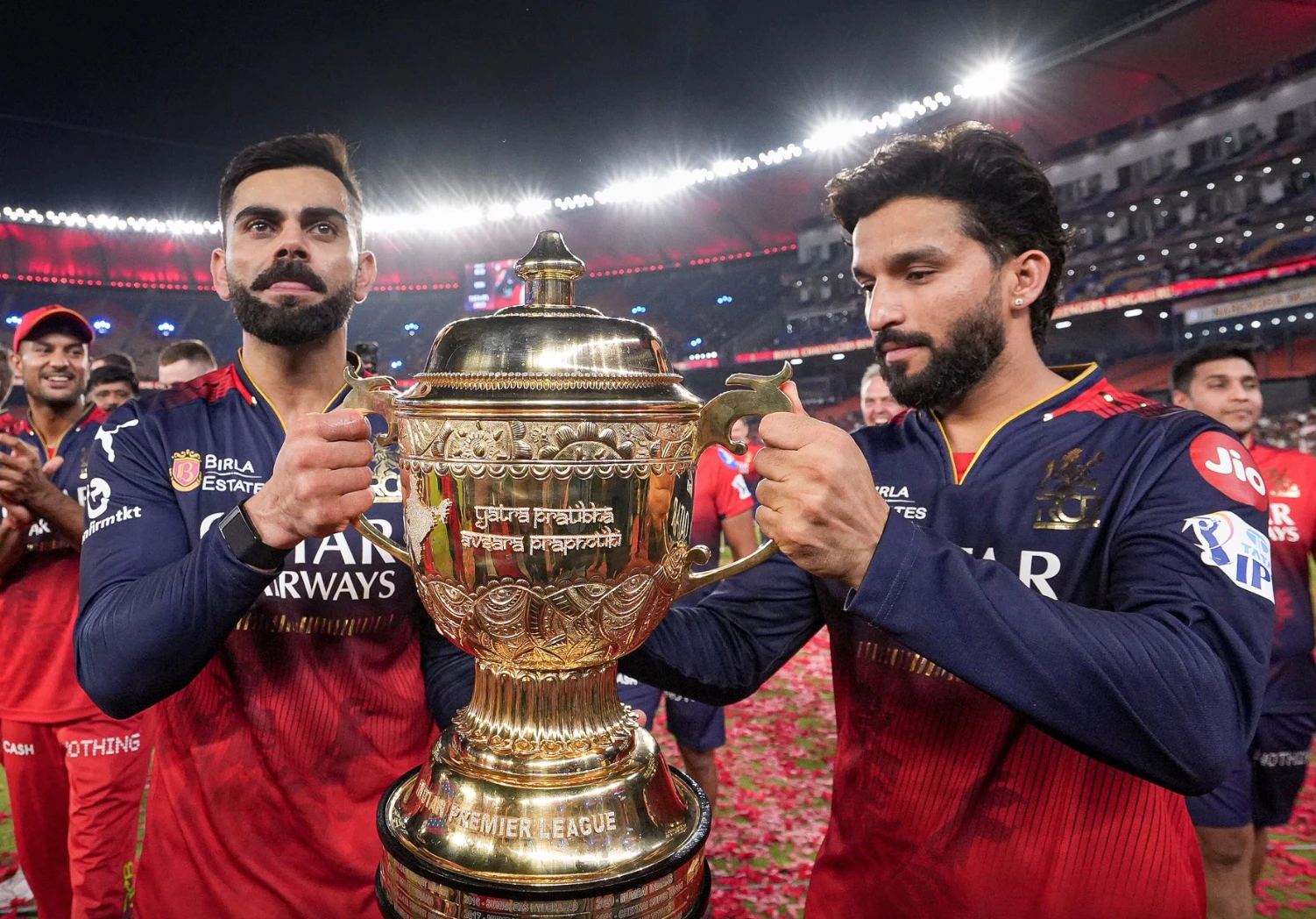 Virat Kohli and Rajat Patidar lift the IPL trophy