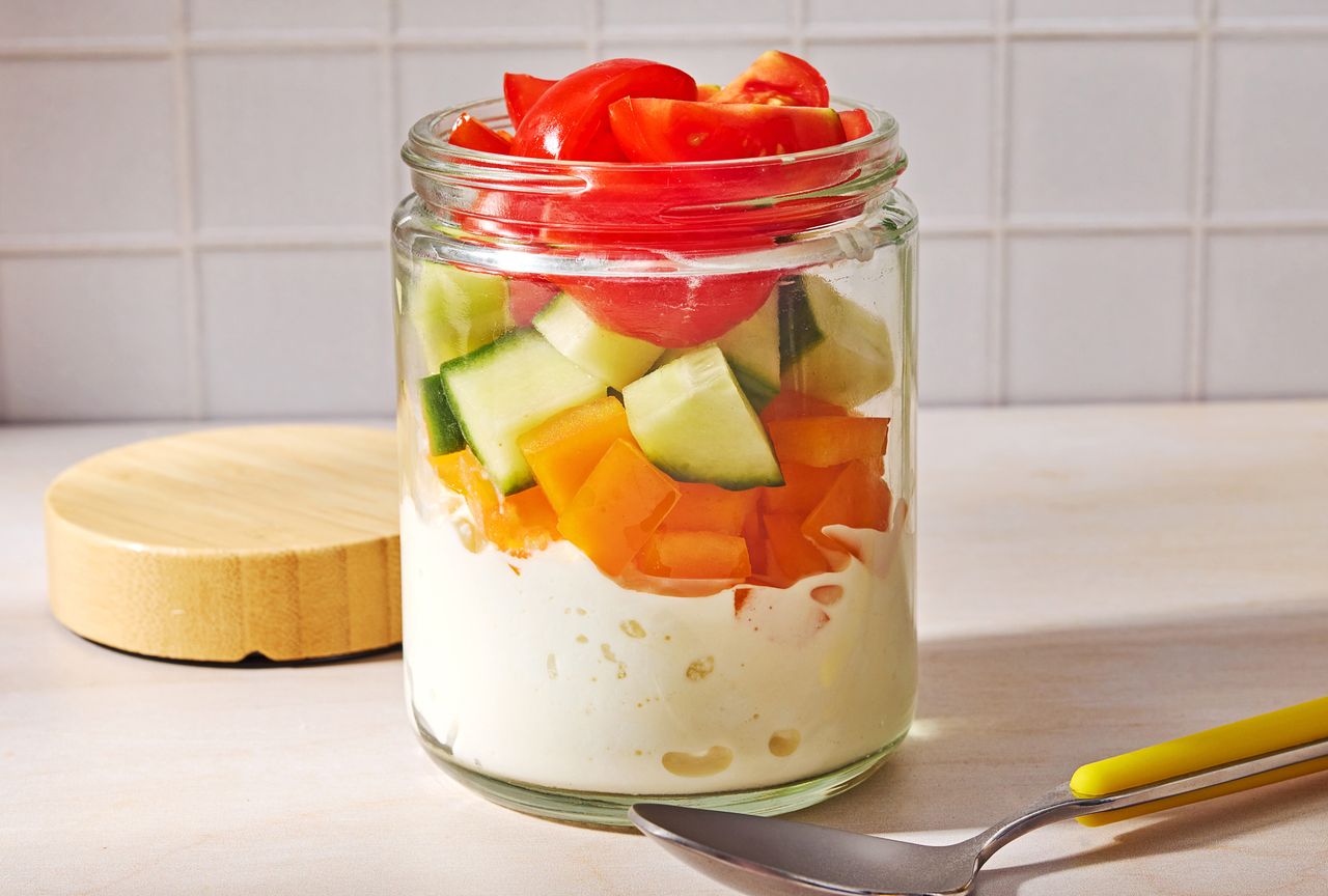 Cottage Cheese Snack Jar with Tomatoes, Cucumbers, and Bell Peppers Credit: Photographer: Ali Redmond.