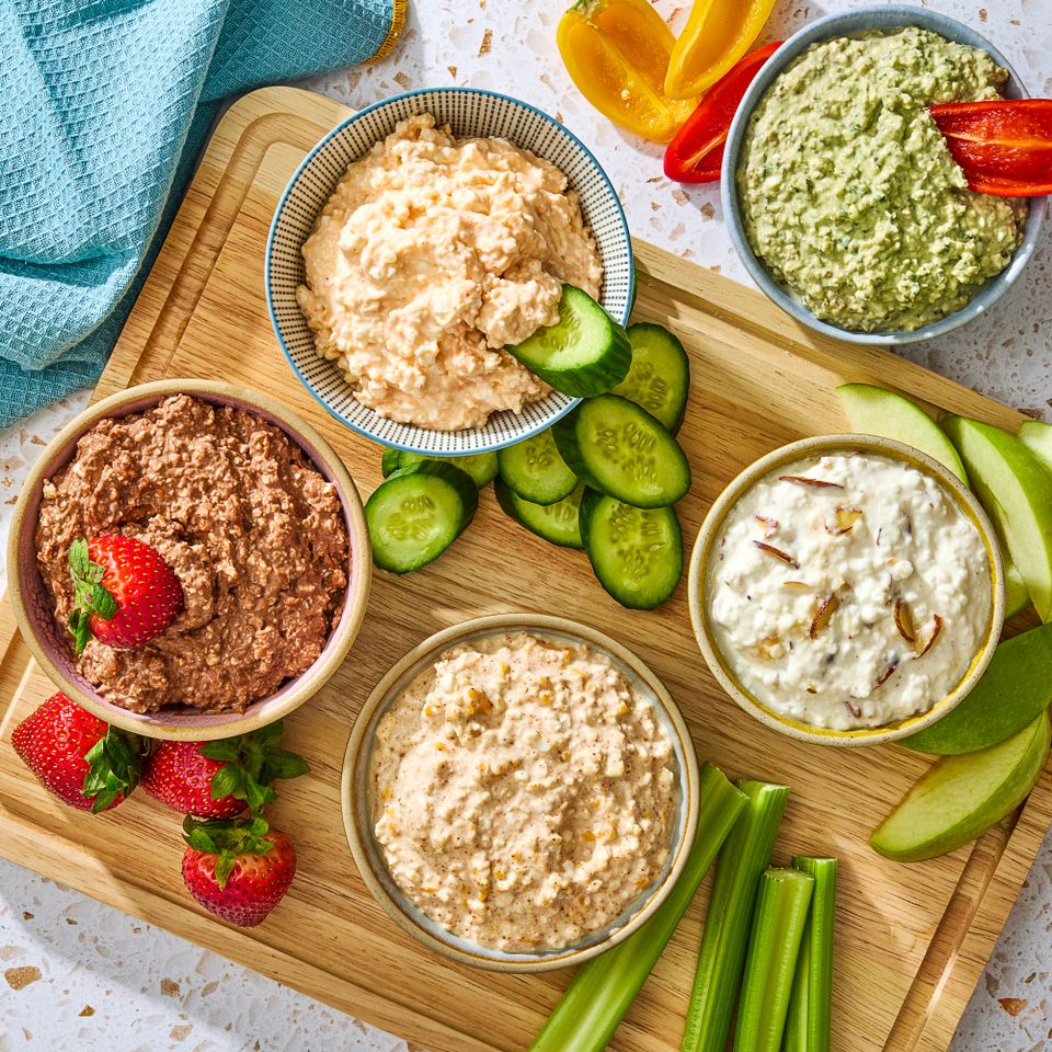 High-protein dips and dippers on a board Credit: Ali Redmond