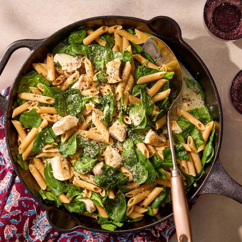 an image of the Chicken & Spinach Skillet Pasta with Lemon & Parmesan Credit: Photographer: Jake Sternquist, Food Stylist: Holly Dreesman, Prop Stylist: Natalie Ghazali