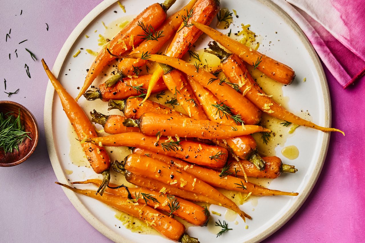 Recipe image of Melting Carrots with Lemon & Dill. Credit: Photographer: Greg Dupree, Prop Stylist: Julia Bayless, Food Stylist: Chelsea Zimmer.
