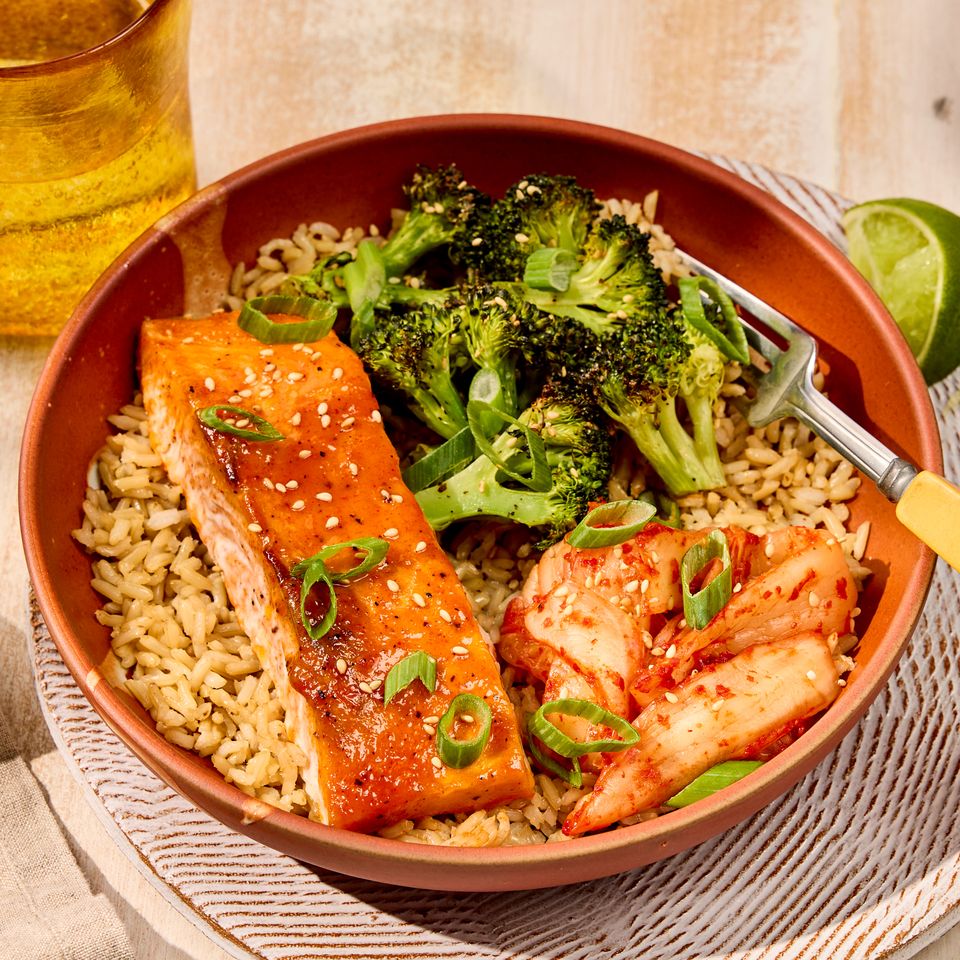 Photo of Spicy Roasted Salmon and Broccoli Rice Bowl Credit: Robby Lozano, Food Stylist: Amanda Holstein, Prop Stylist: Josh Hoggle