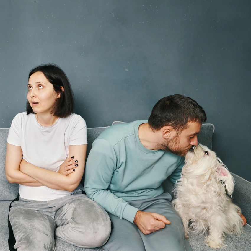 woman annoyed by boyfriend's close relationship with dog