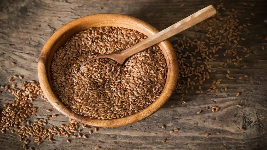 flaxseed in the bowl on wooden table