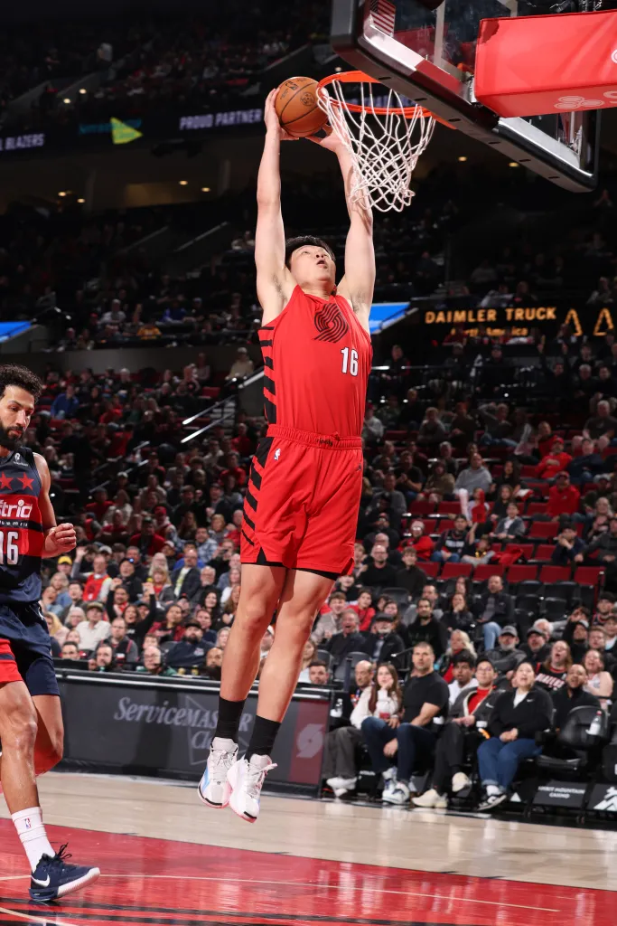 Yang Hansen #16 of the Portland Trail Blazers dunks the ball during the game against the Washington Wizards on March 29, 2026 at the Moda Center Arena in Portland.
