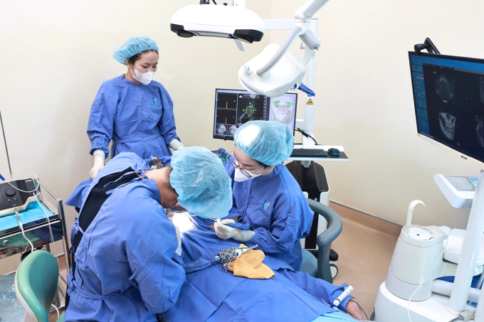 A dentist at Dr. Care Implant Clinic performs a procedure on Norbert. Photo courtesy of Dr. Care
