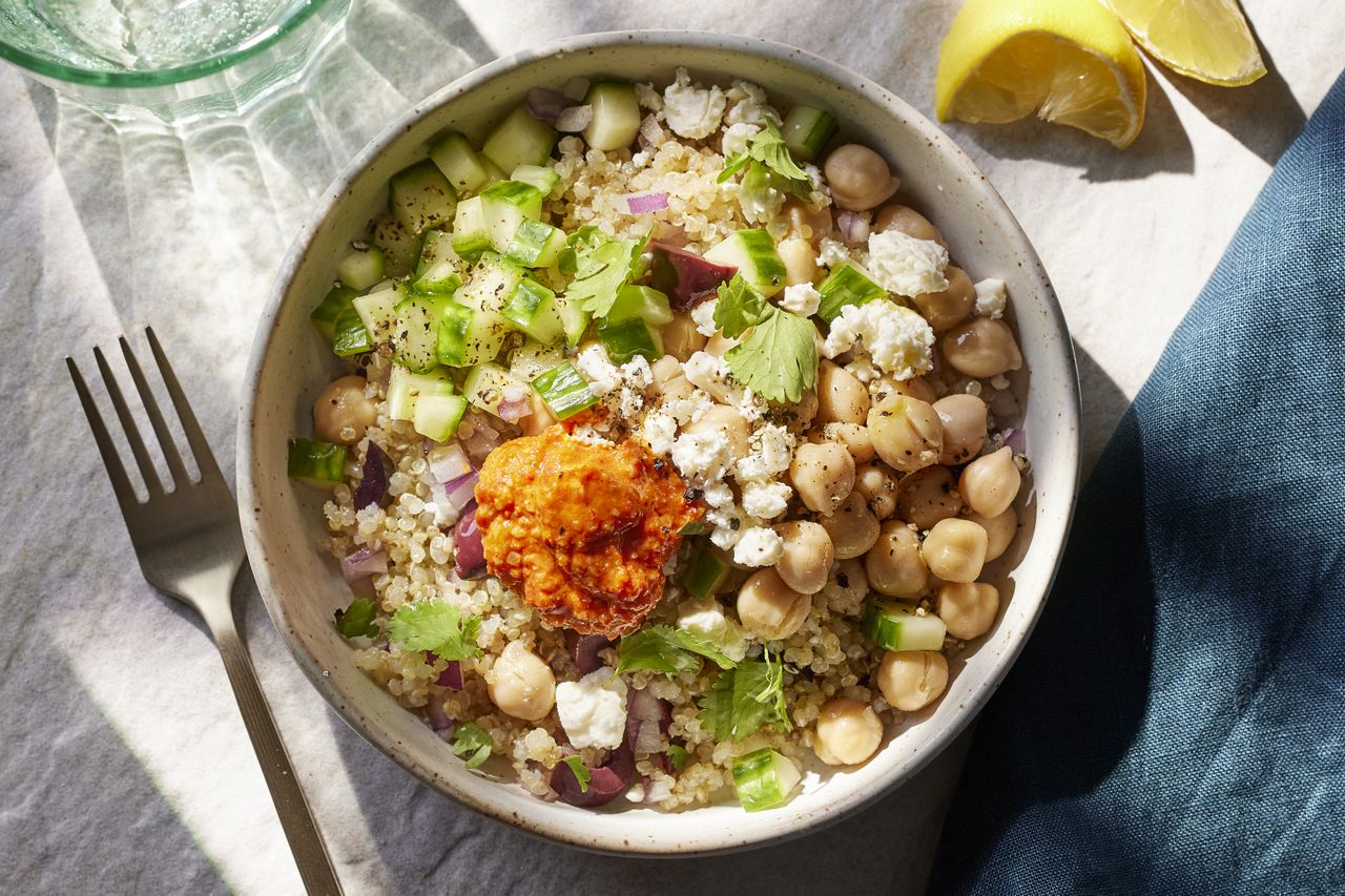 a recipe photo of the Chickpea & Quinoa Bowl with Roasted Red Pepper Sauce Credit: Photographer: Carson Downing, Food Stylist: Holly Dreesman, Prop Stylist: Gabriel Greco