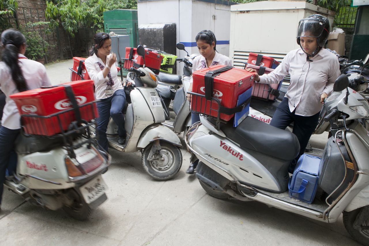 Yakult Danone India employees arrive to stock up on their probiotic drink supply at a Yakult center in New Delhi, India.Credit: Prashanth Vishwanathan/Bloomberg via Getty Images