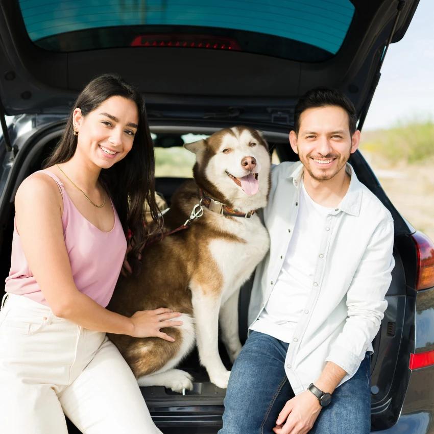 woman who loves her dog having fun on a road trip with her life partner