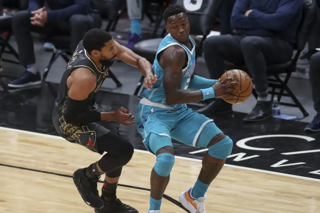Terry Rozier of the Charlotte Hornets dribbles the ball against Garrett Temple of the Chicago Bulls.