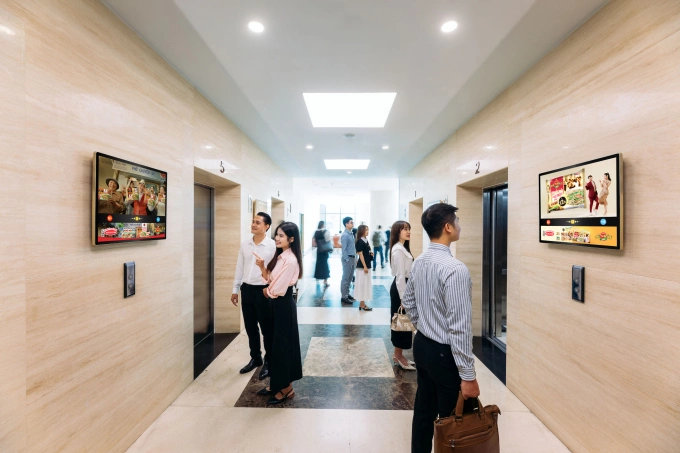 Advertising screens installed an office lobby. Photo courtesy of Chicilon Media