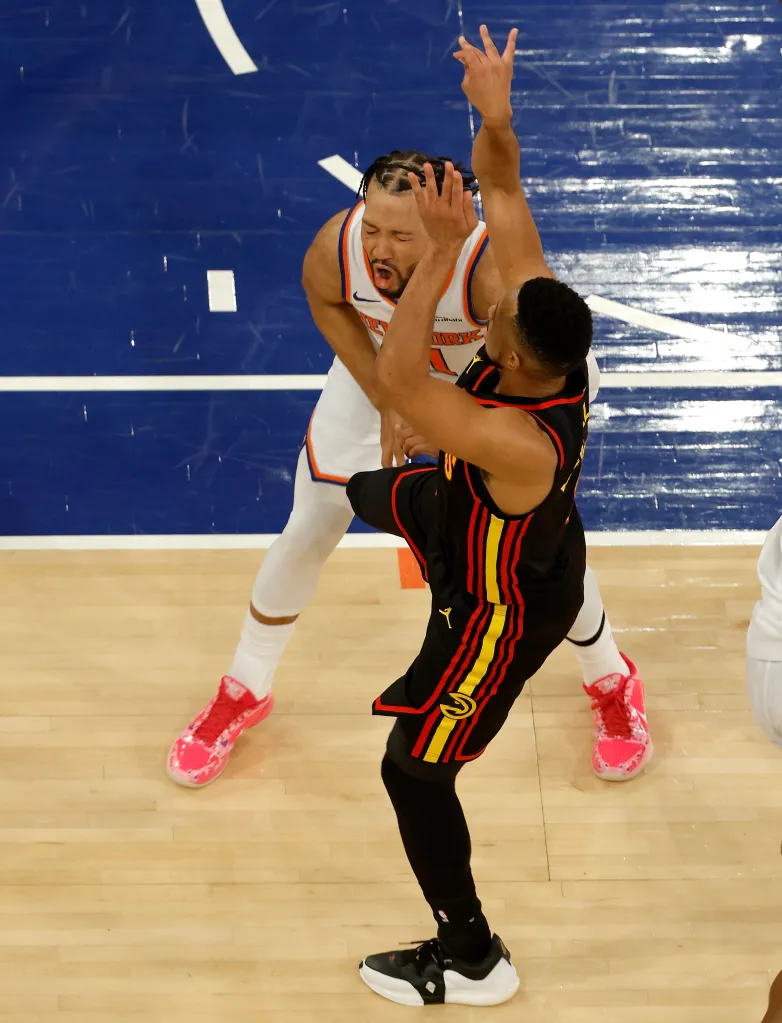 Atlanta Hawks guard CJ McCollum (3) attempts a shot while kicking New York Knicks guard Jalen Brunson (11) in the groin during the third quarter.