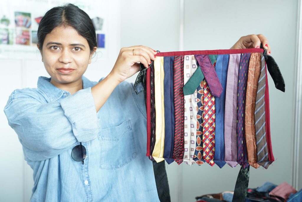 A-BAG-MADE-OUT-OF-DISCARDED-TIES-DISPLAYED-FOR-SALE-BY-GOONJ_REPURPOSED