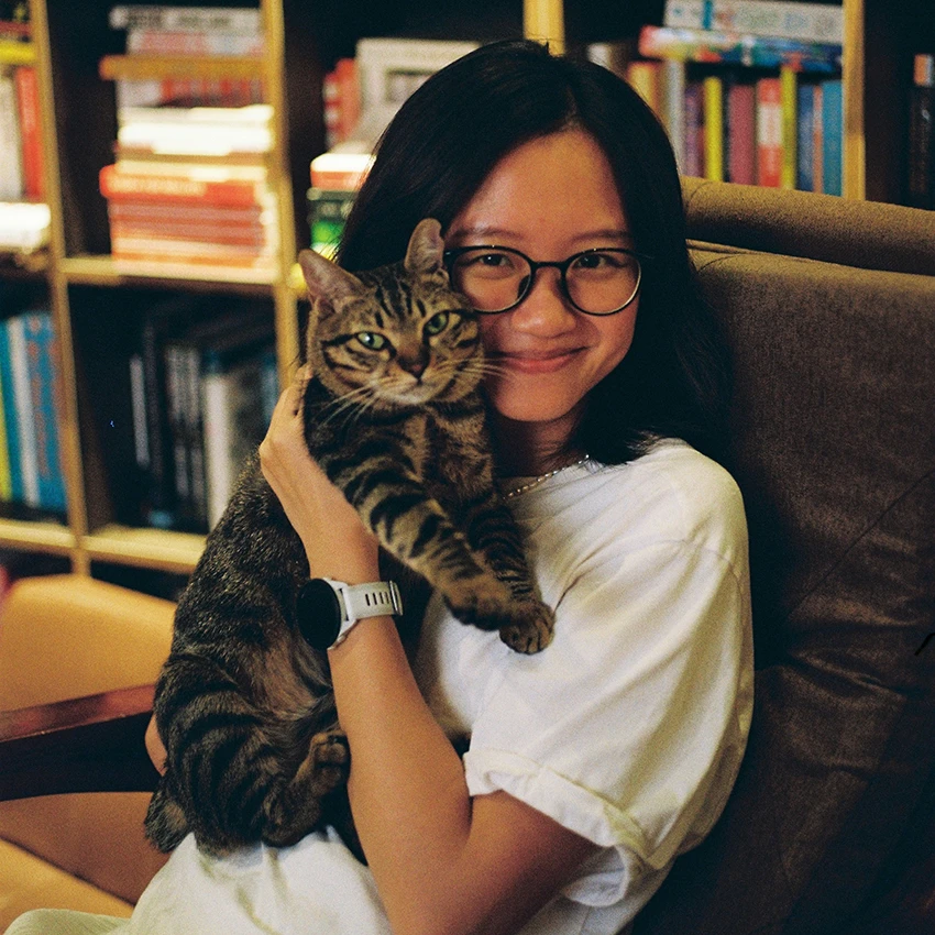 student happy holding cat