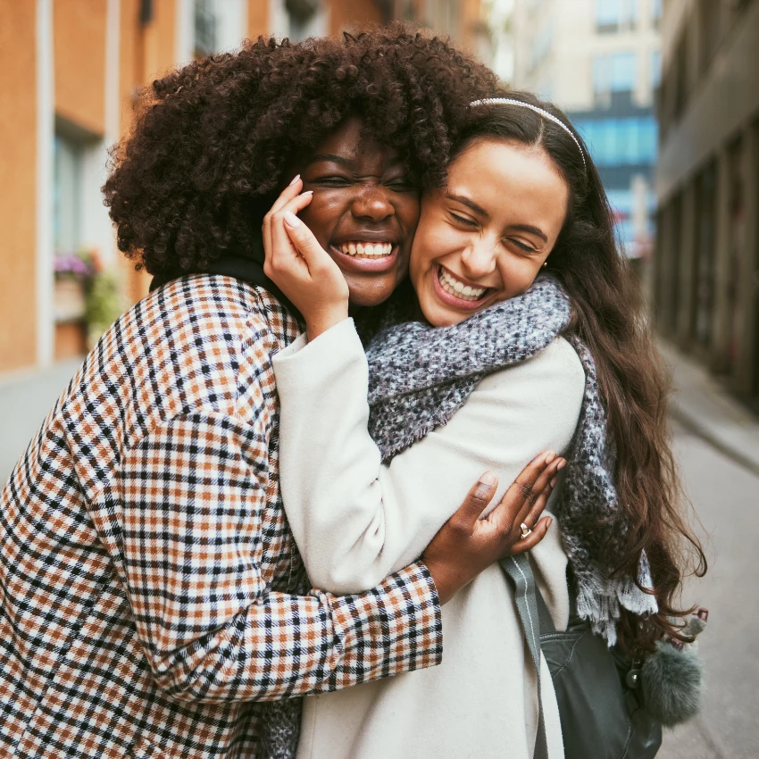 intuitive woman with high emotional intelligence hugging her friend