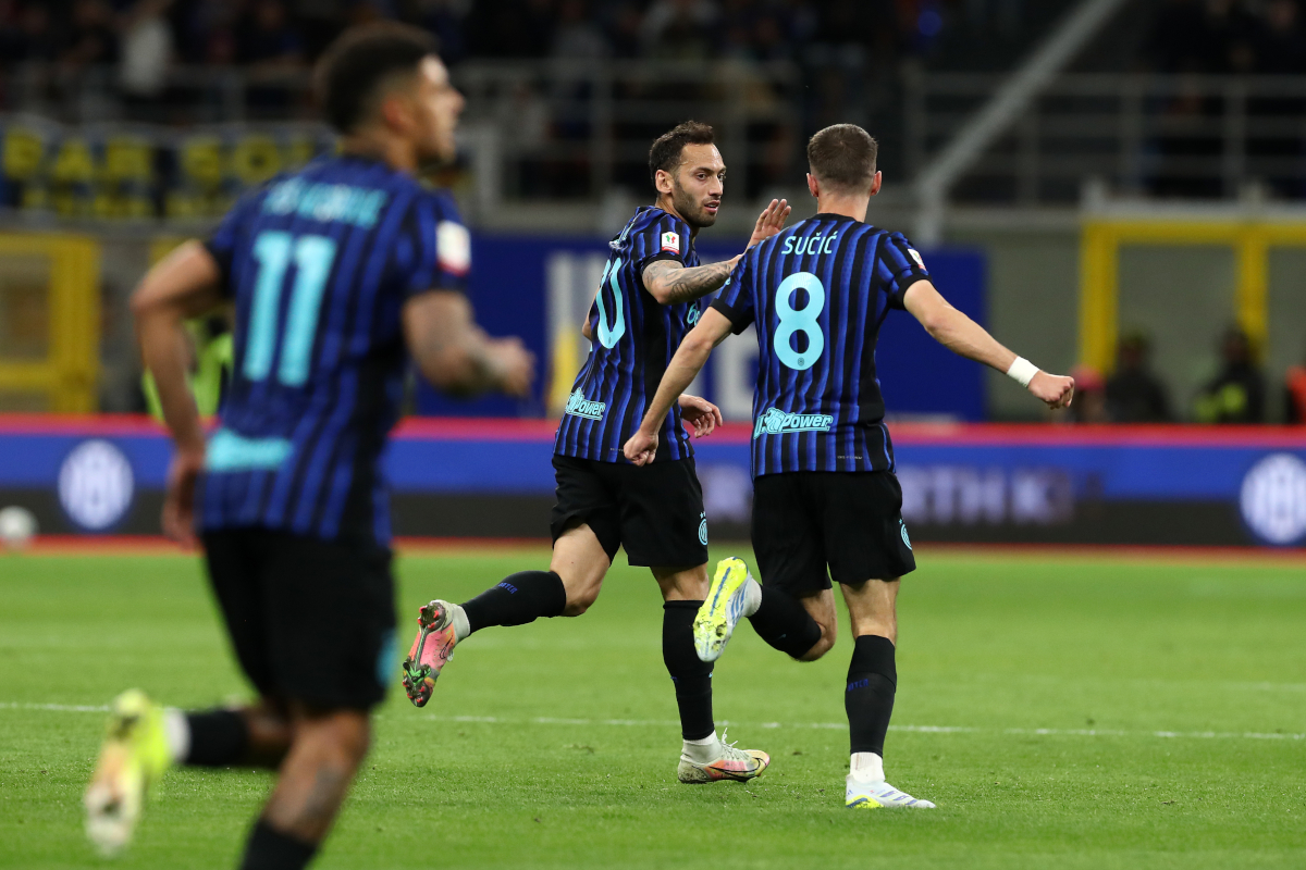 MILAN, ITALY - APRIL 21: Hakan Calhanoglu of FC Internazionale Milano celebrates scoring his team's first goal with Petar Sucic during the Coppa Italia Semi-Final match between FC Internazionale and Como at San Siro on April 21, 2026 in Milan, Italy. (Photo by Marco Luzzani/Getty Images)