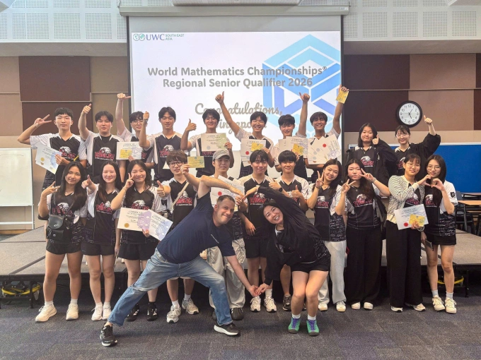 Jesse Aguilar (R), AP Statistics Teacher is an AP Reader. Photo courtesy of St. Paul American School Hanoi