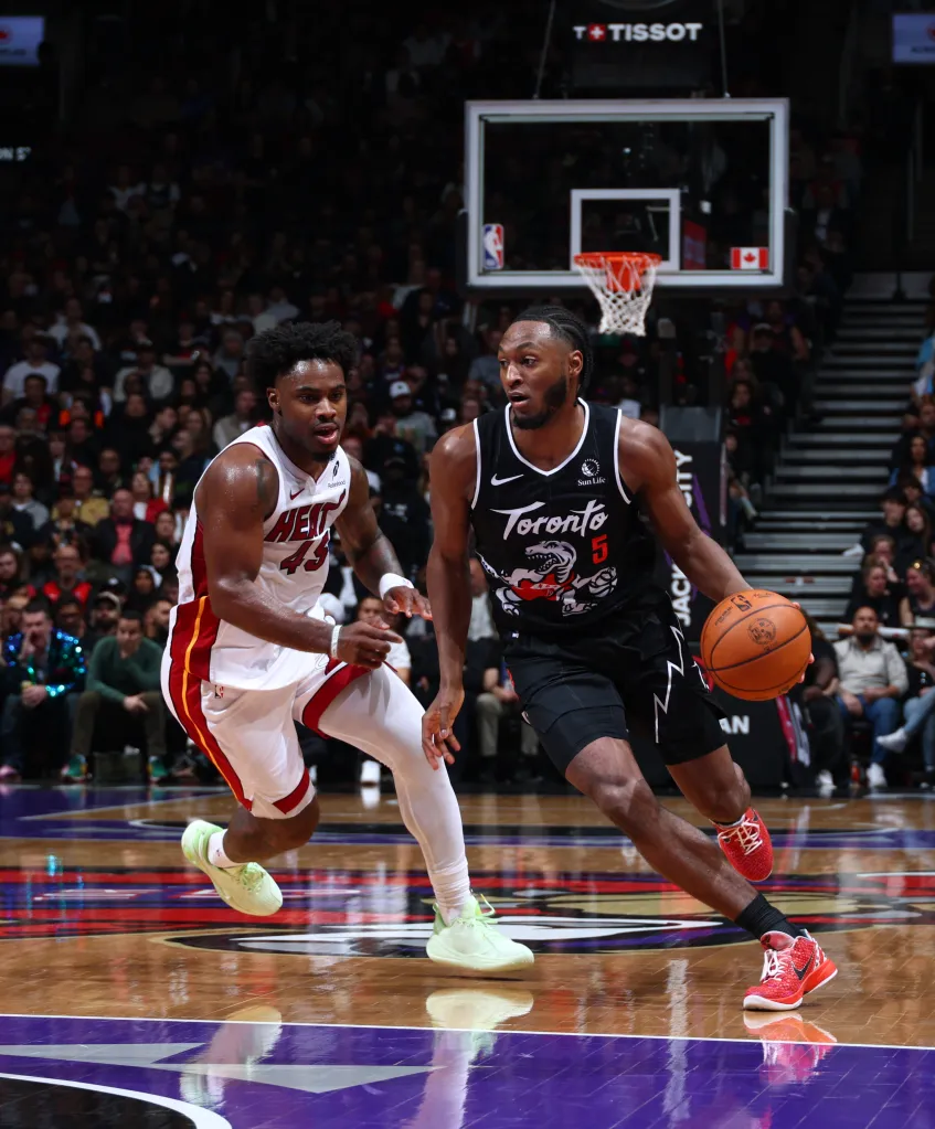 Immanuel Quickley of the Toronto Raptors drives to the basket against the Miami Heat.