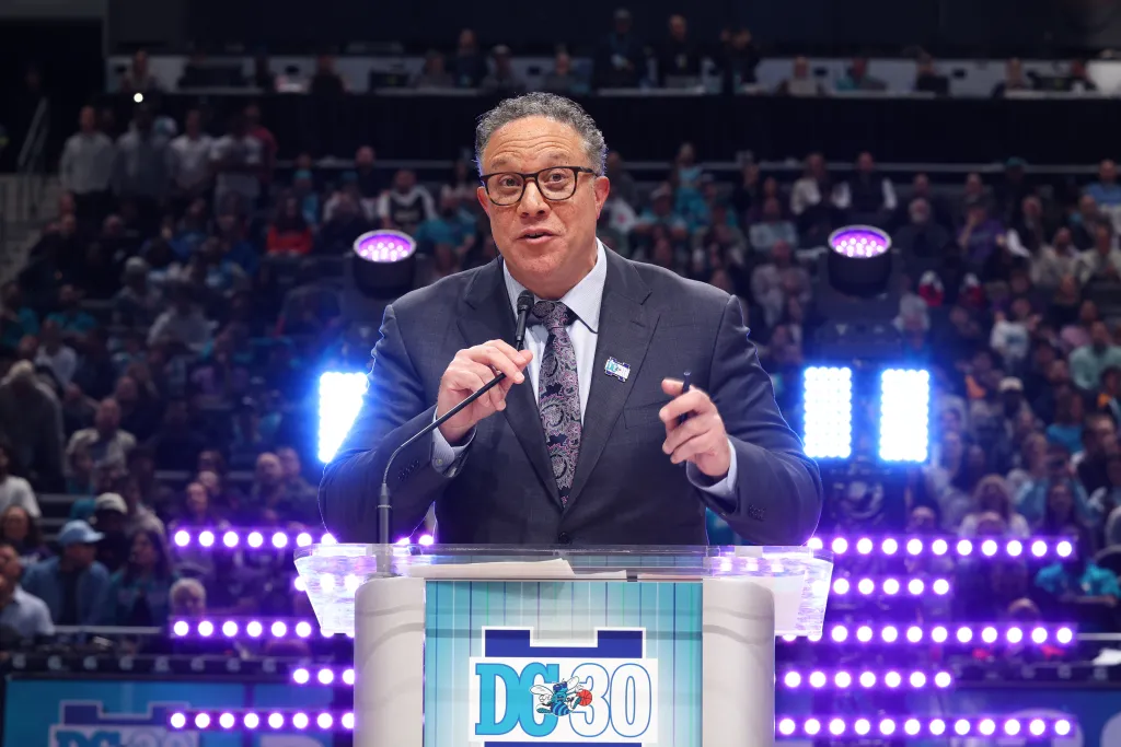 Eric Collins speaking at the Dell Curry #30 jersey retirement ceremony.