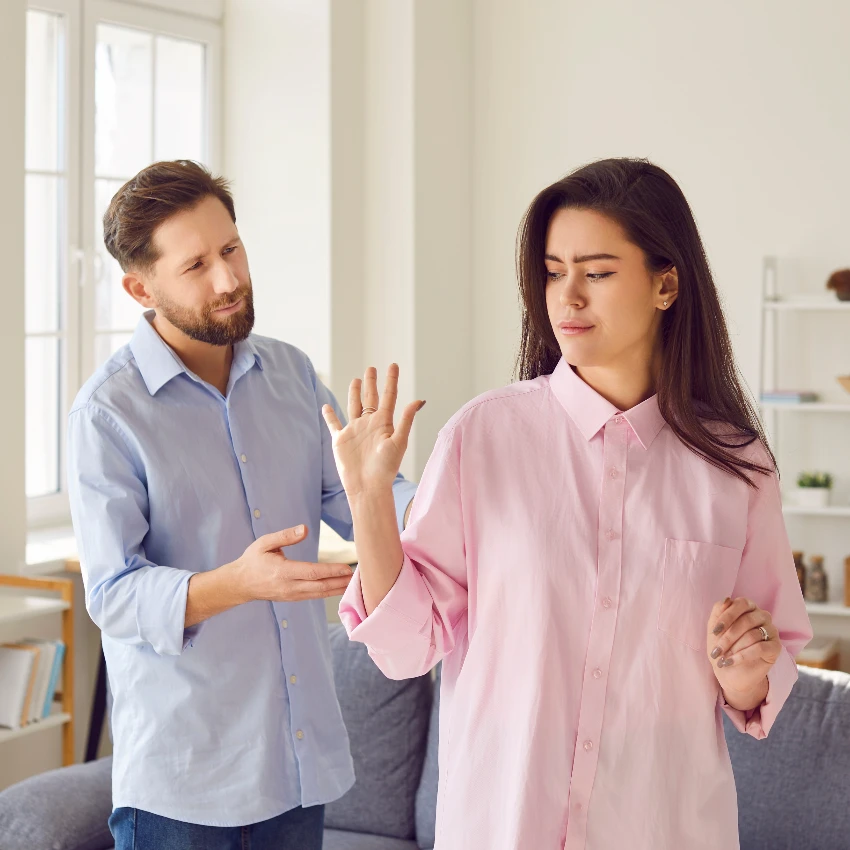 defensive woman dismissing husband during argument