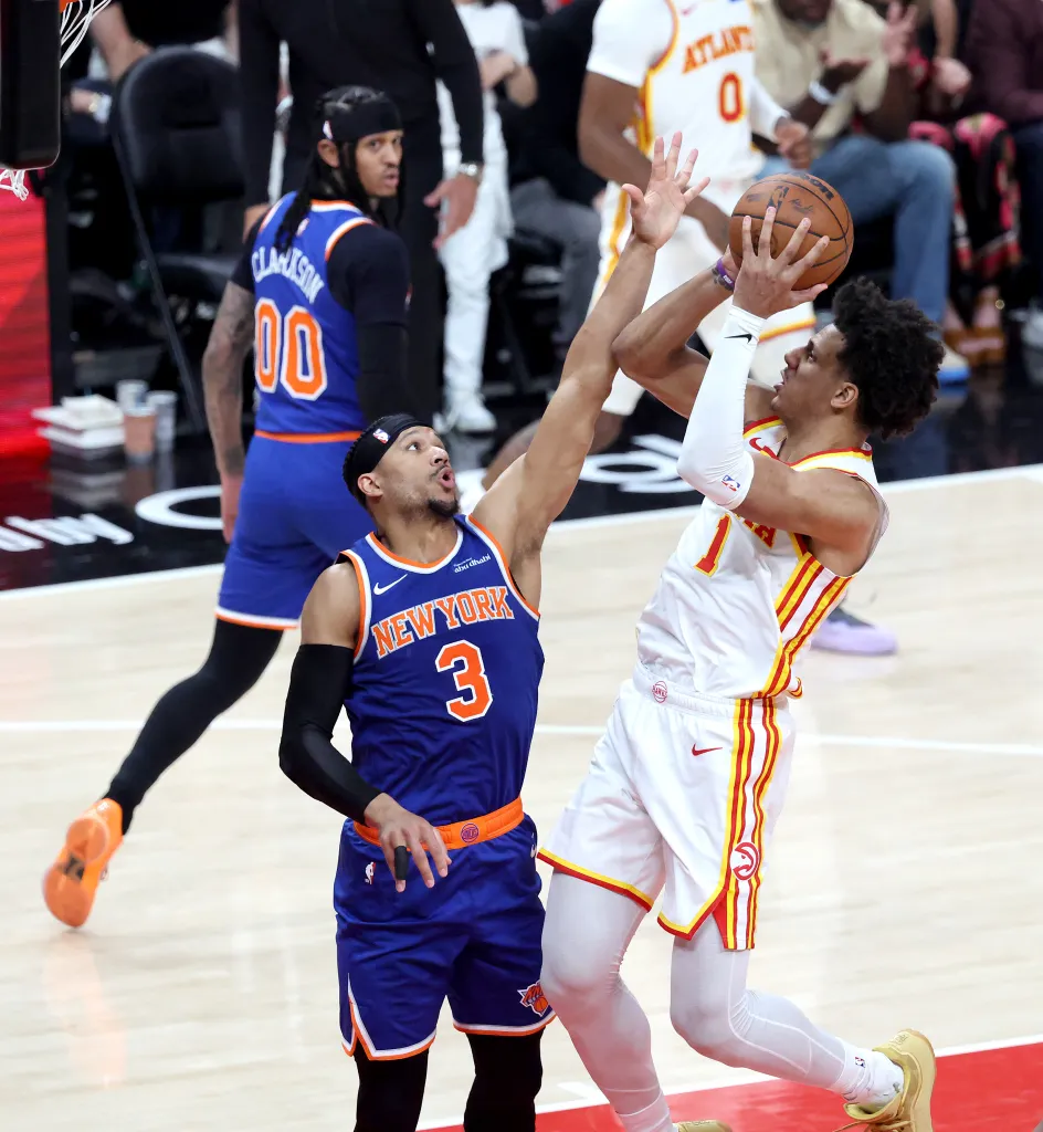 Jalen Johnson (1) puts up a shot as New York Knicks guard Josh Hart (3) defends during the second quarter.