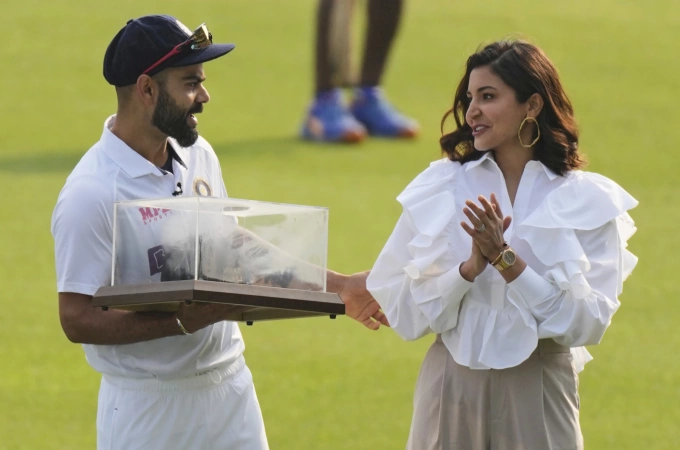 Virat Kohli with his wife, actress Anushka Sharma, at a ceremony honoring his 100th test, ahead of the first test between India and Sri Lanka in Mohali, India, on March 4, 2022. Photo by AP