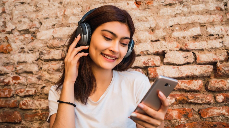 young woman listening music woman listening to spotify music