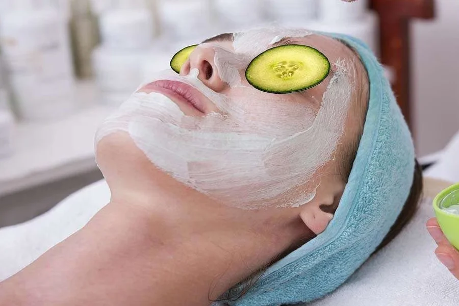 Woman protecting face from harsh summer sun with skincare routine tips