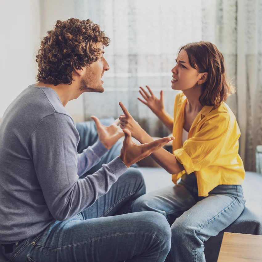 woman fighting with stay-at-home boyfriend trying to get him to step up so they can find relationship balance