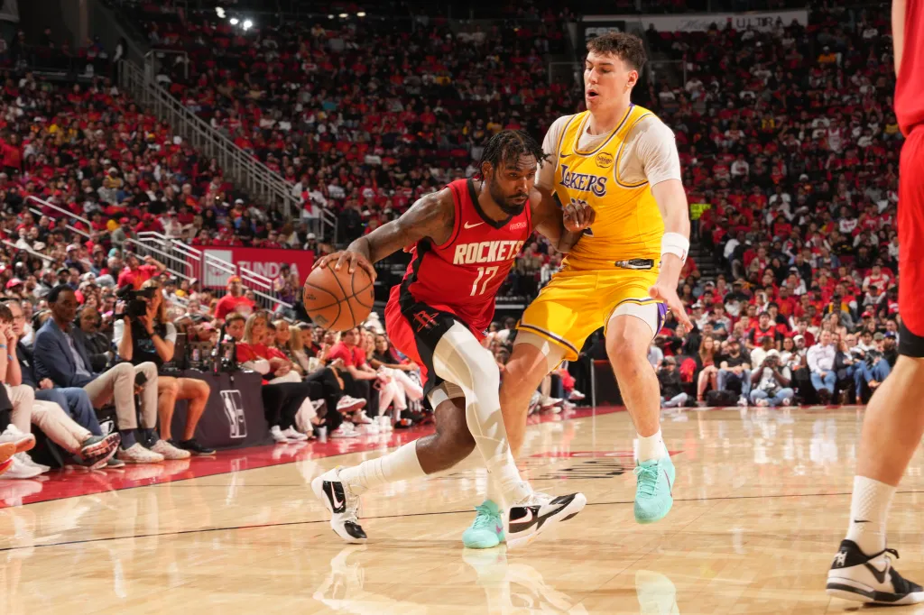 Houston Rockets player Tari Eason dribbling the ball while guarded by a Los Angeles Lakers player during Game Six.